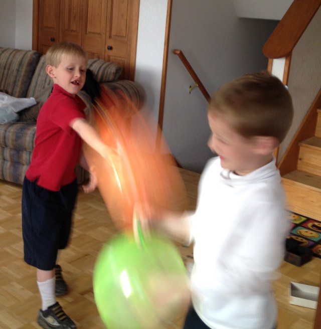 Seth and Noah battle with punching balls