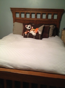 Oh my gosh, I DID it!  There really WAS a bed underneath all of that! 